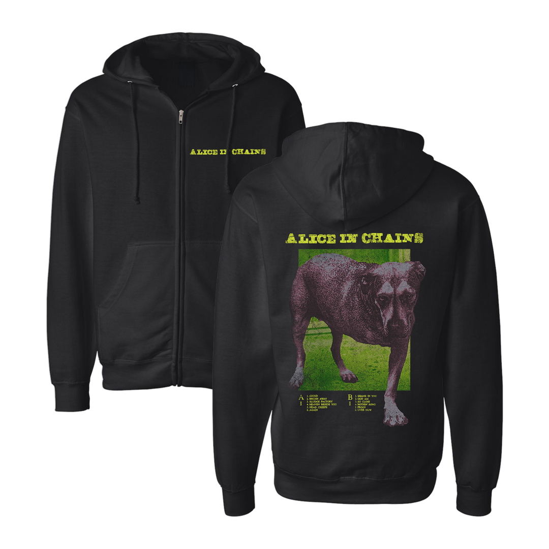 Black zip-up hoodie featuring a graphic of a dog on the back and ’alice in chains’ text printed in yellow.